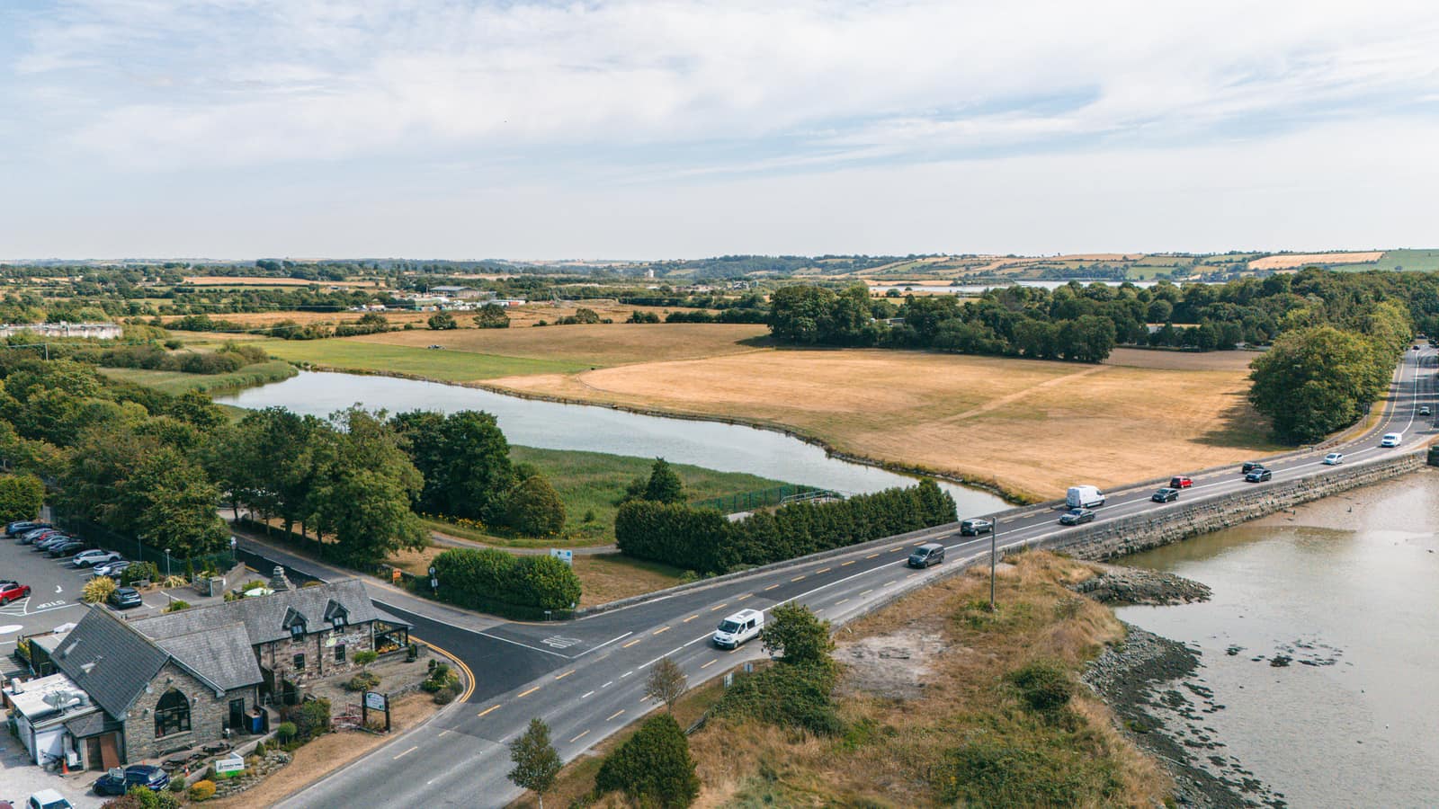 Bramley Lodge from the air, beside the estuary and green fields at Tullagreen