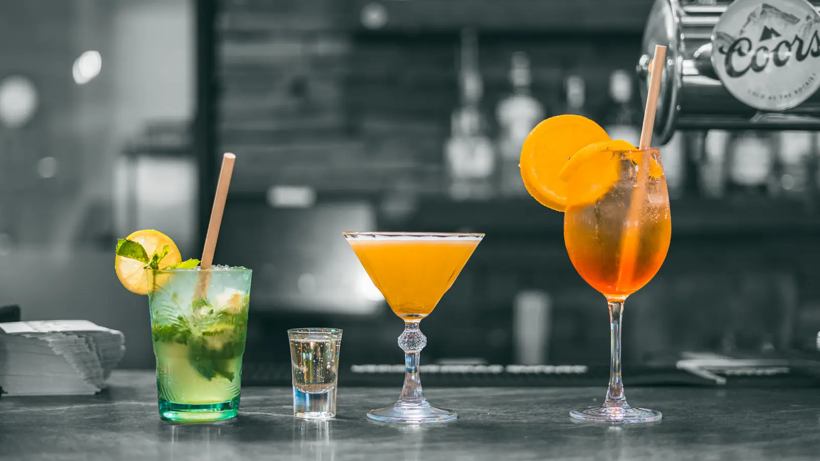 Three cocktails lined up on the bar at Bramley Lodge