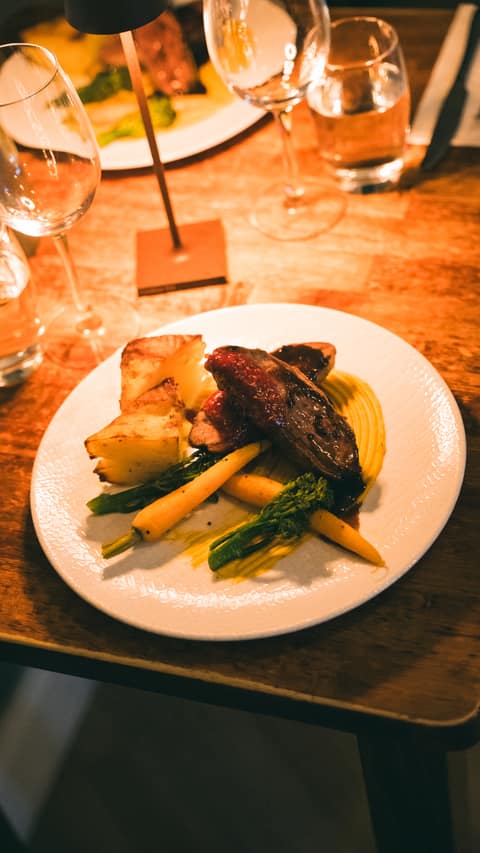 An overhead view of an evening main with potatoes, carrots and broccoli