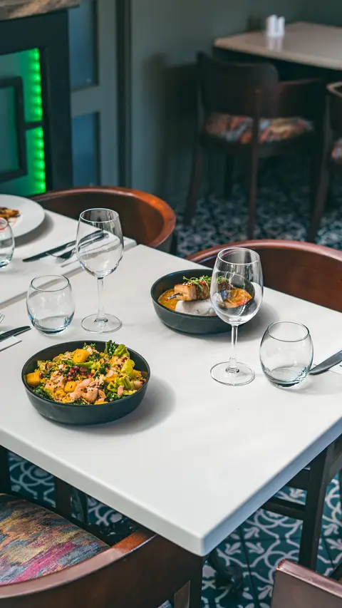 A set table with dishes ready for service