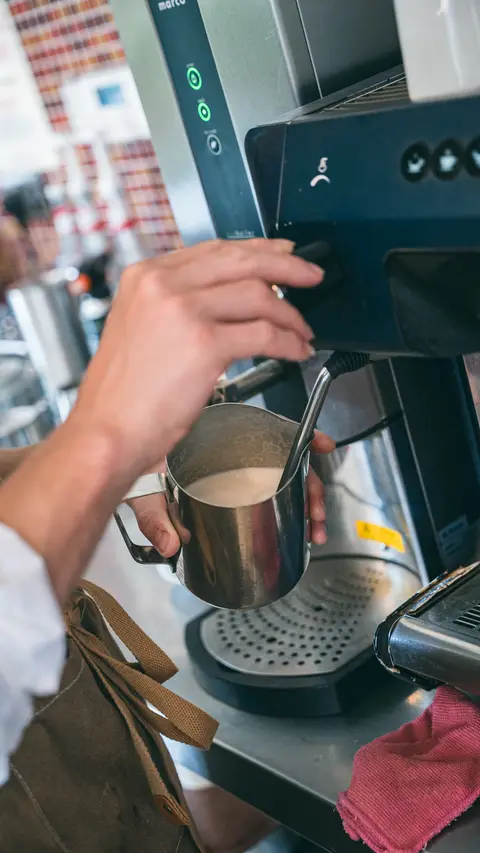 Milk being steamed for a coffee